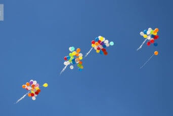 balloons flying up into the sky
